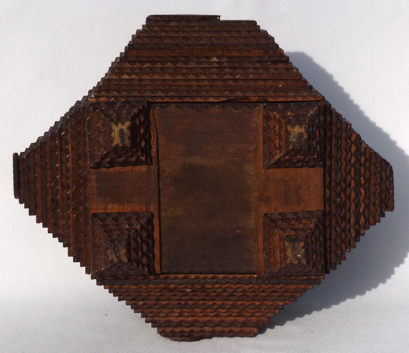 Tramp art box with carved leaves