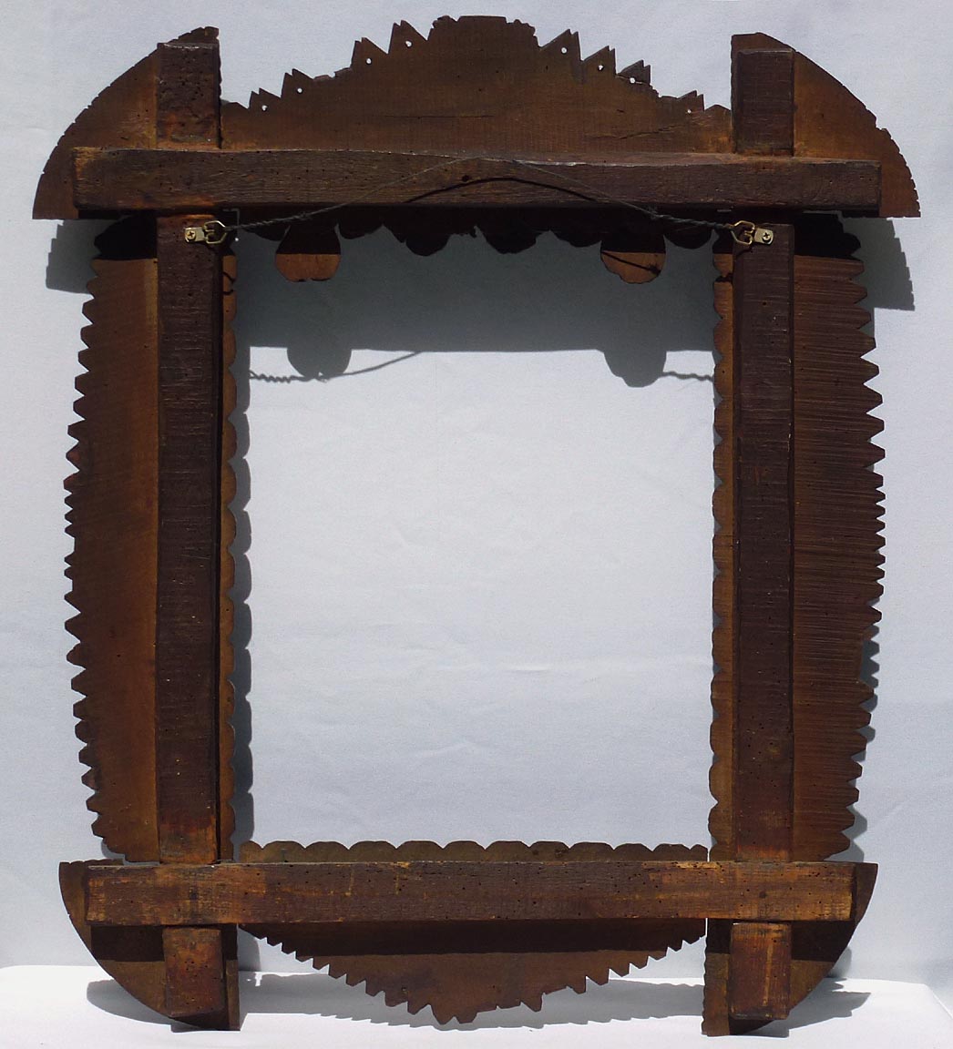 Large tramp art frame with hearts, carved fruit