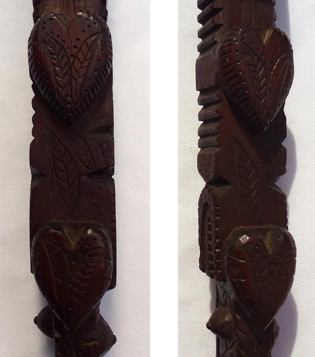 Walking stick carved with snake, hearts, hand, more