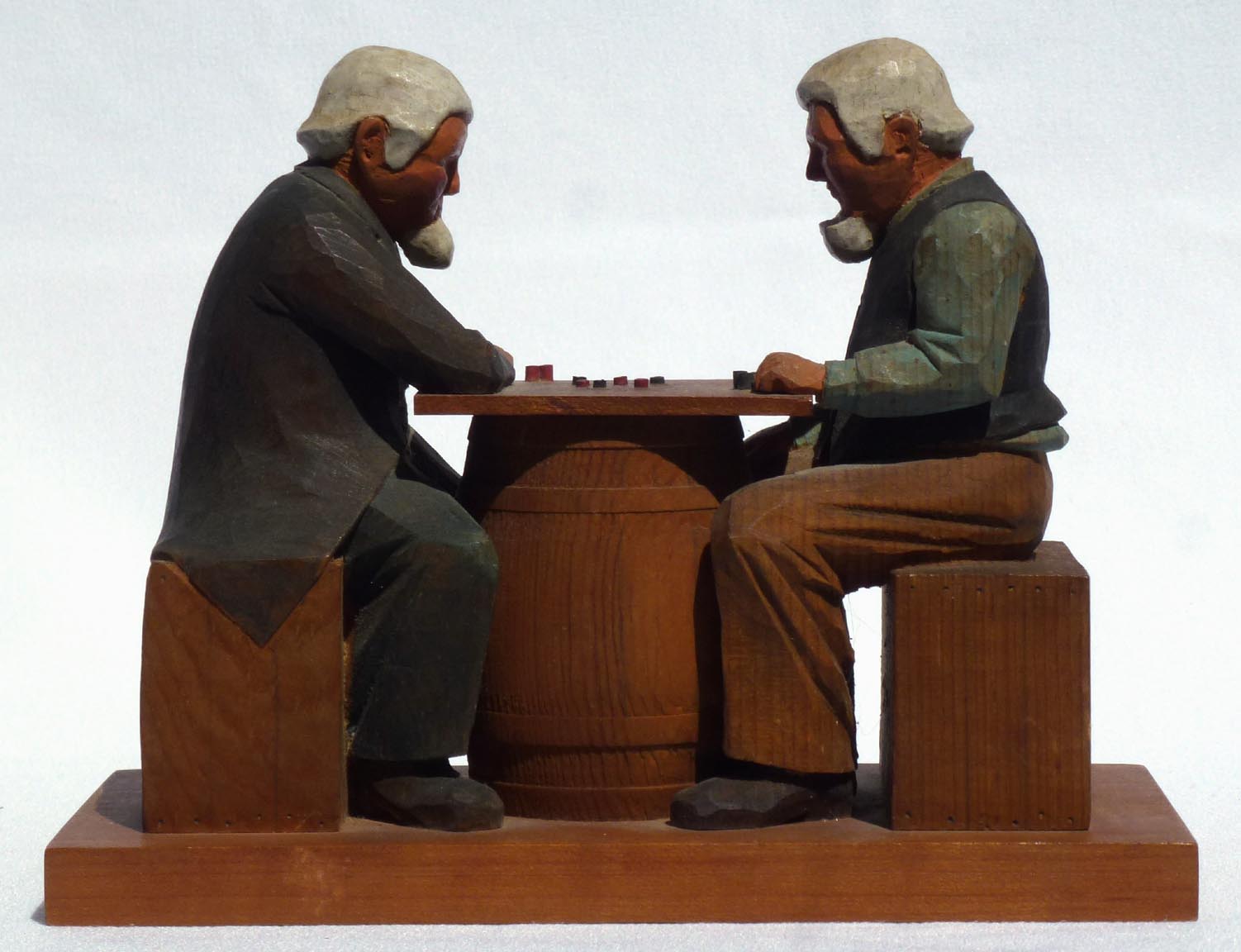 Carving of men playing checkers