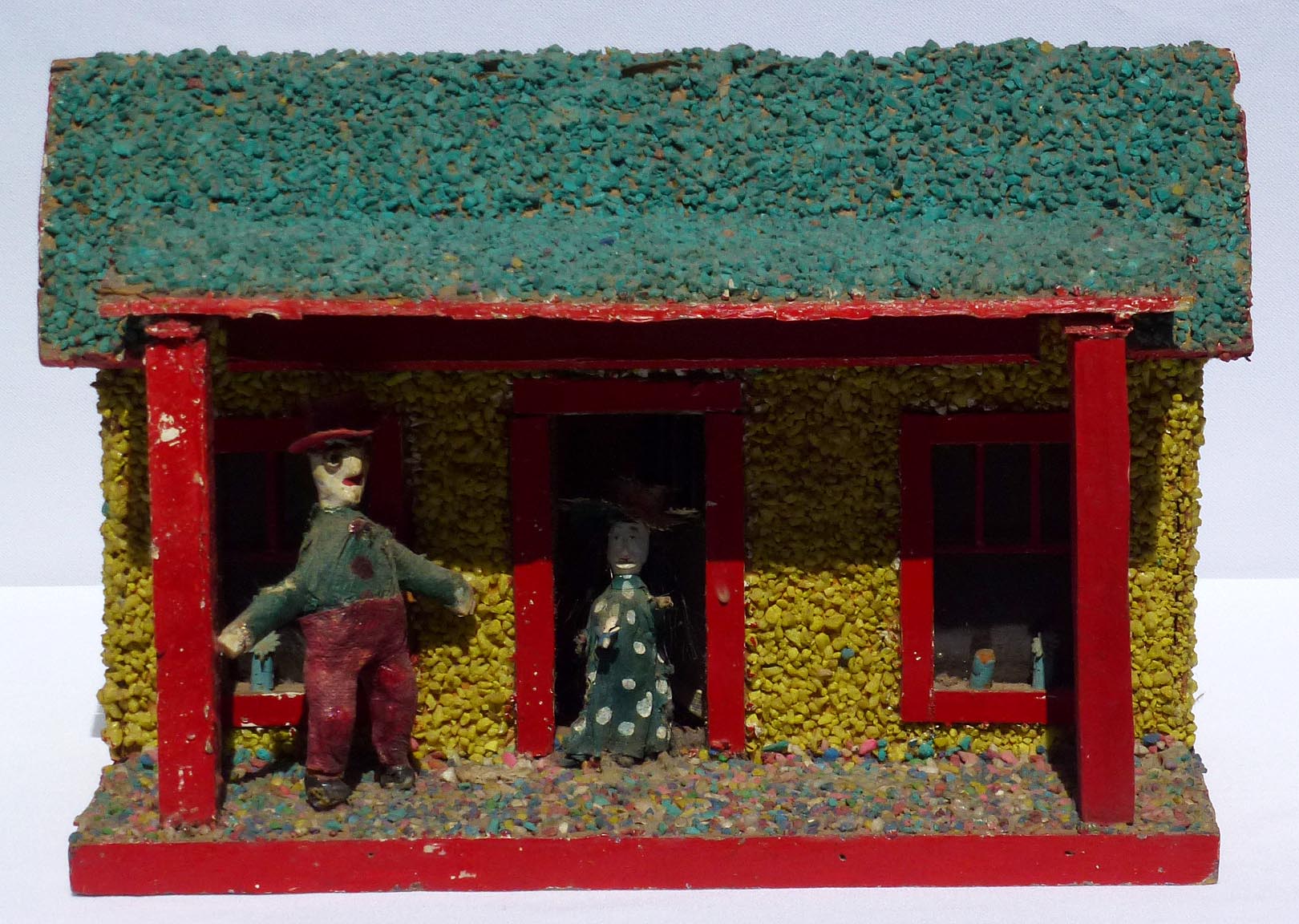 Folky Model Cabin with Carved Couple