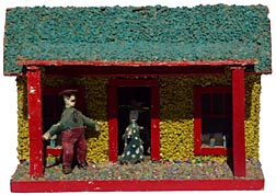 Model cabin with carved couple