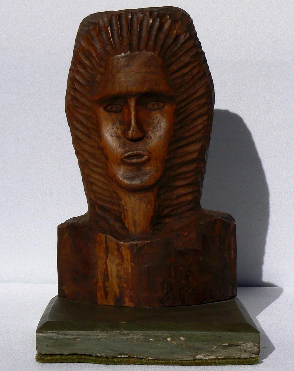 Carved bust on stone base