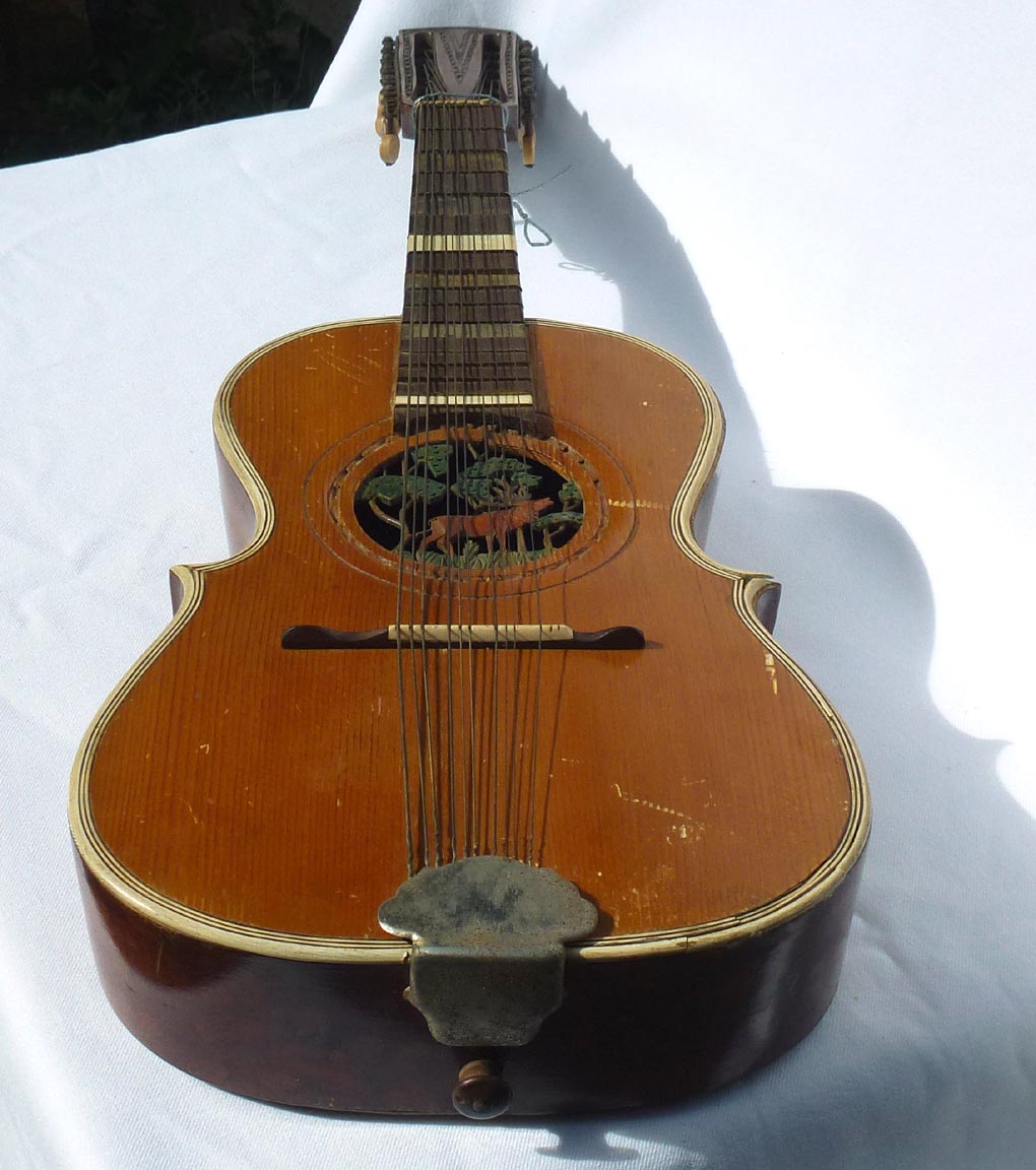 Folk art carved guitar