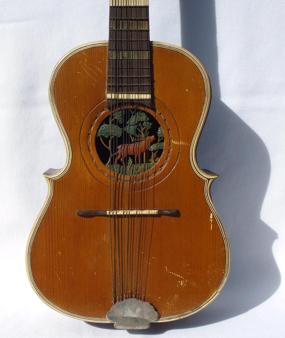 Folk art carved guitar