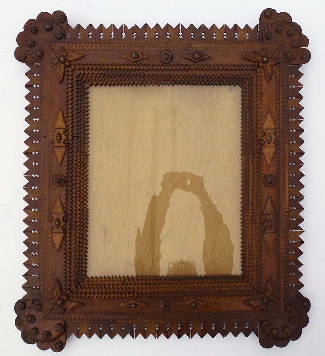 Large tramp art frame with butterflies, pieced border