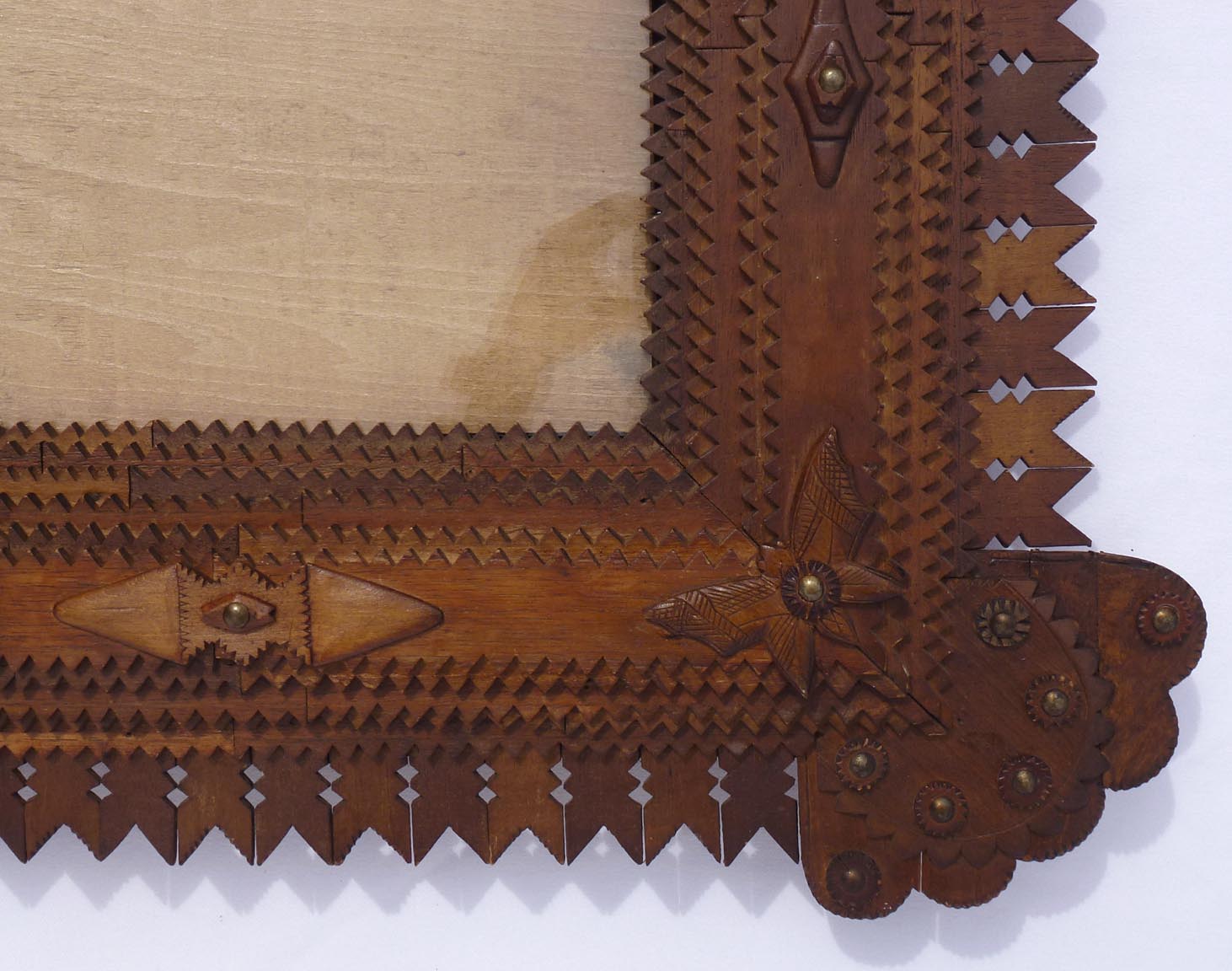 Large tramp art frame with butterflies, pieced border