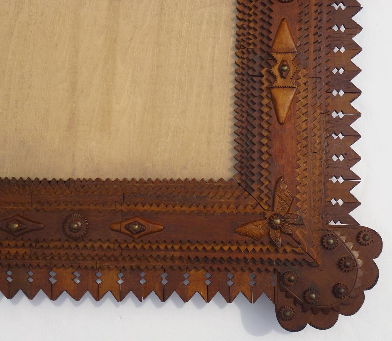 Large tramp art frame with butterflies, pieced border