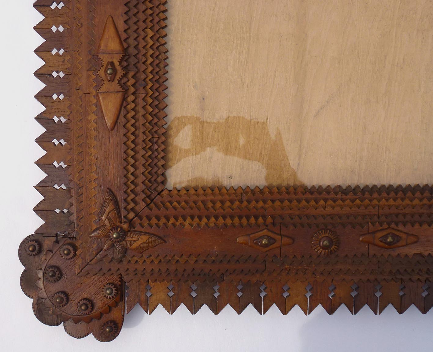 Large tramp art frame with butterflies, pieced border