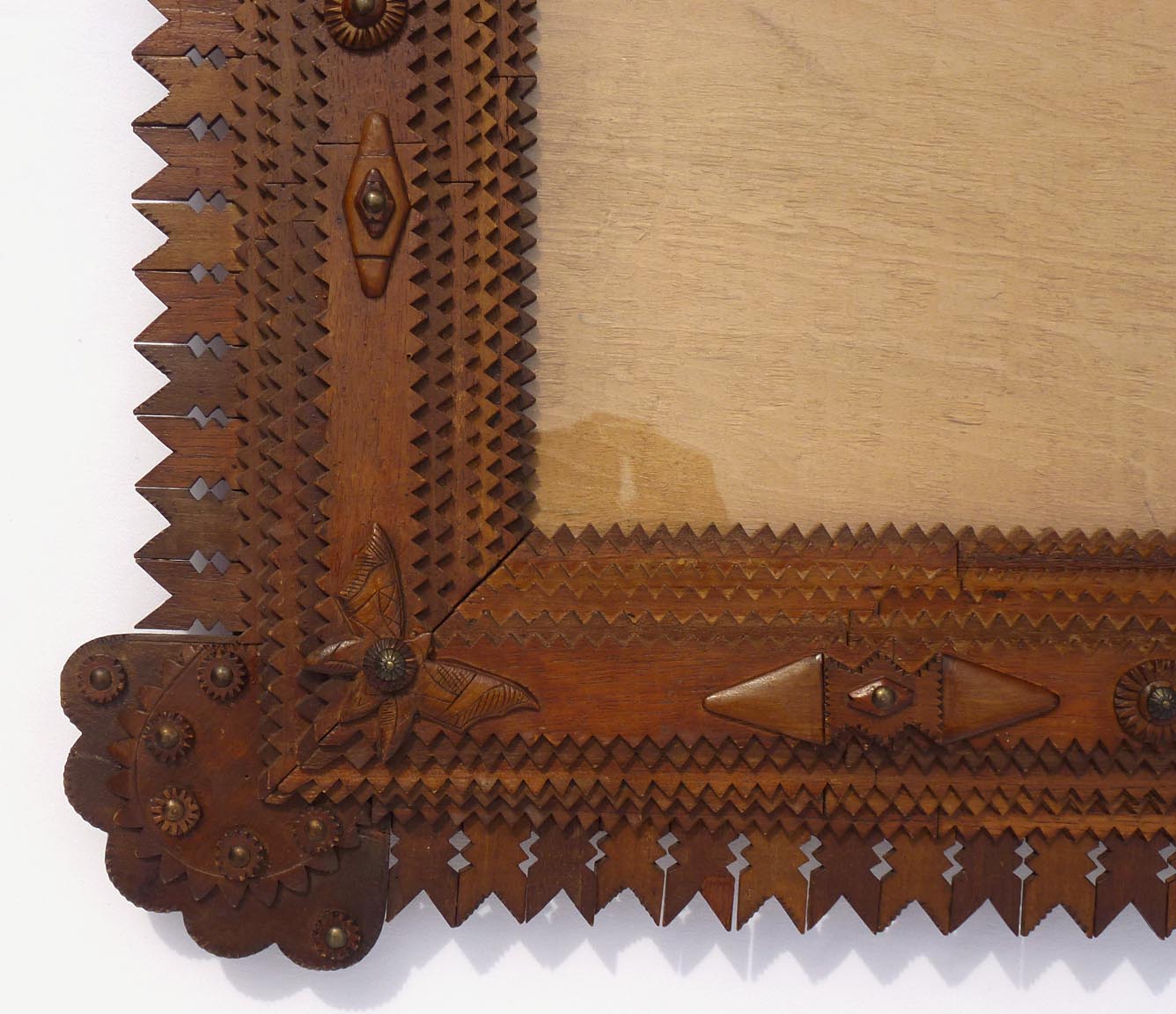 Large tramp art frame with butterflies, pieced border