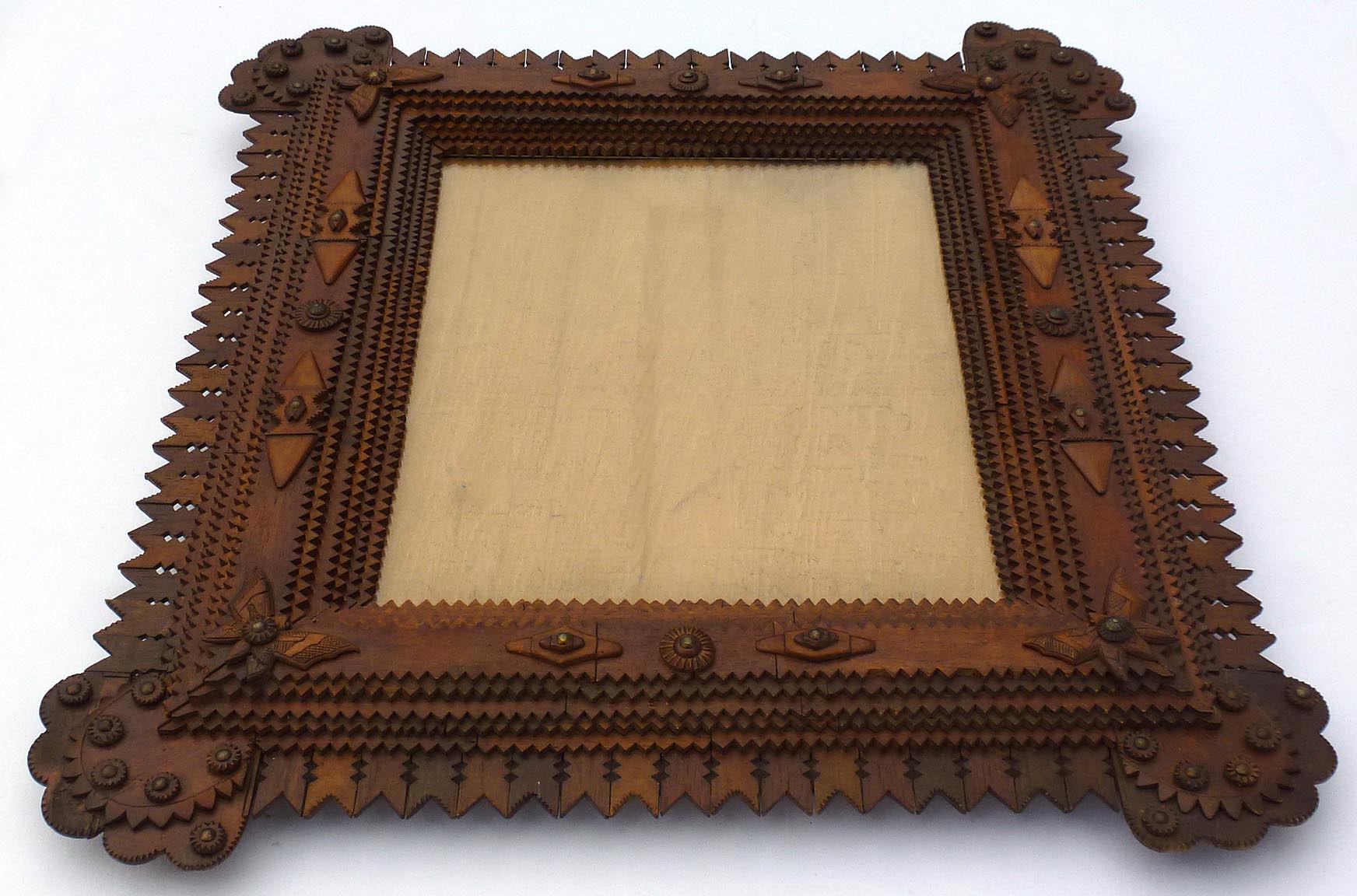 Large tramp art frame with butterflies, pieced border