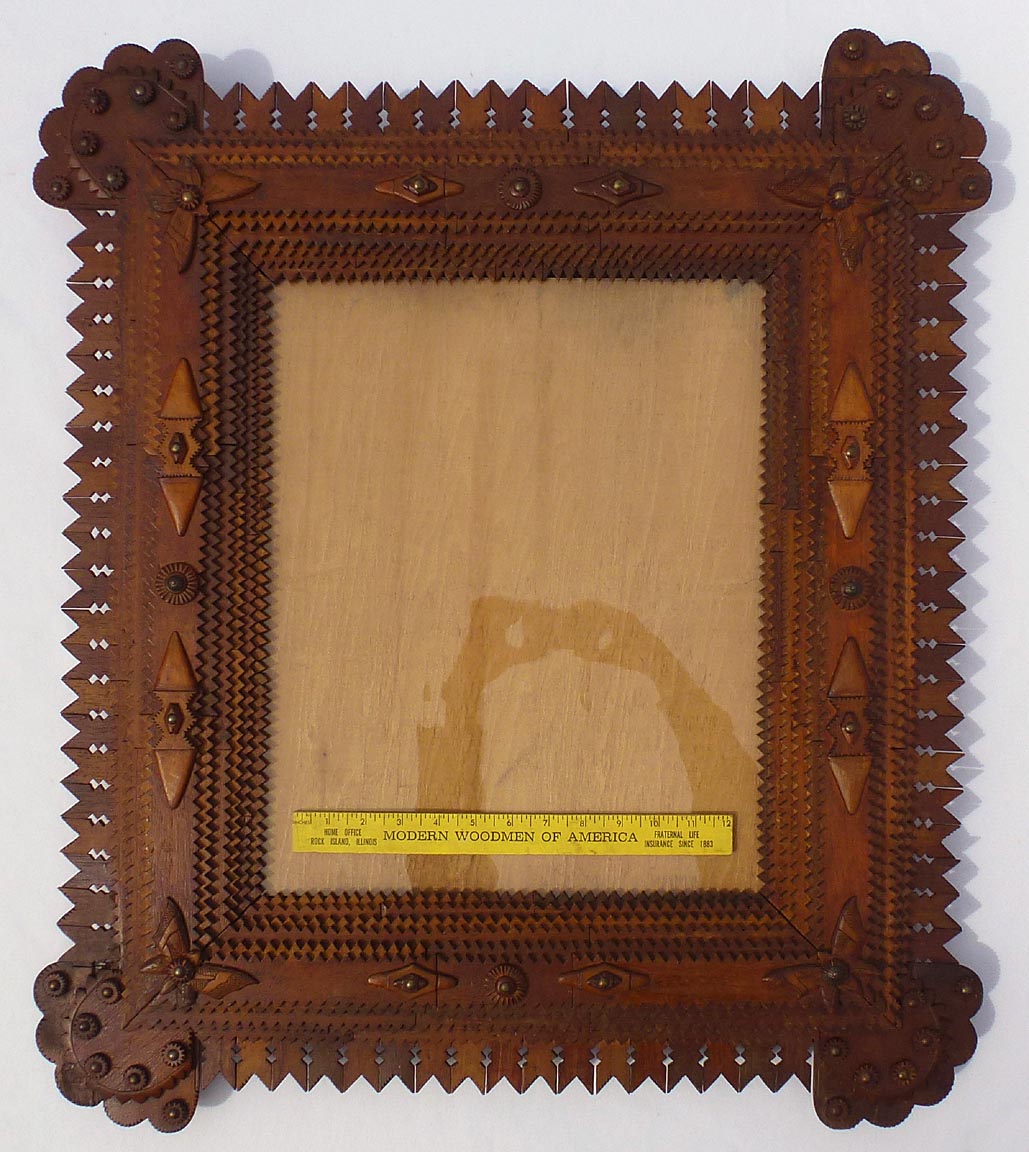 Large tramp art frame with butterflies, pieced border