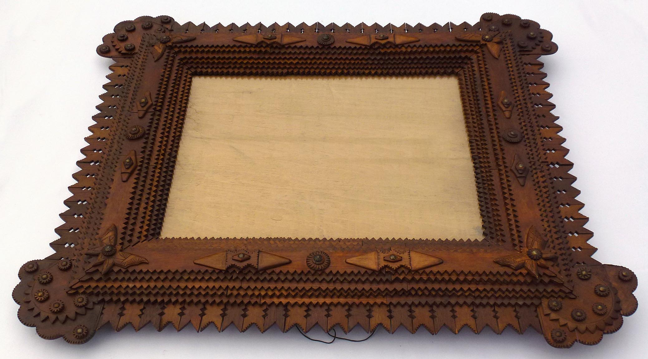 Large tramp art frame with butterflies, pieced border