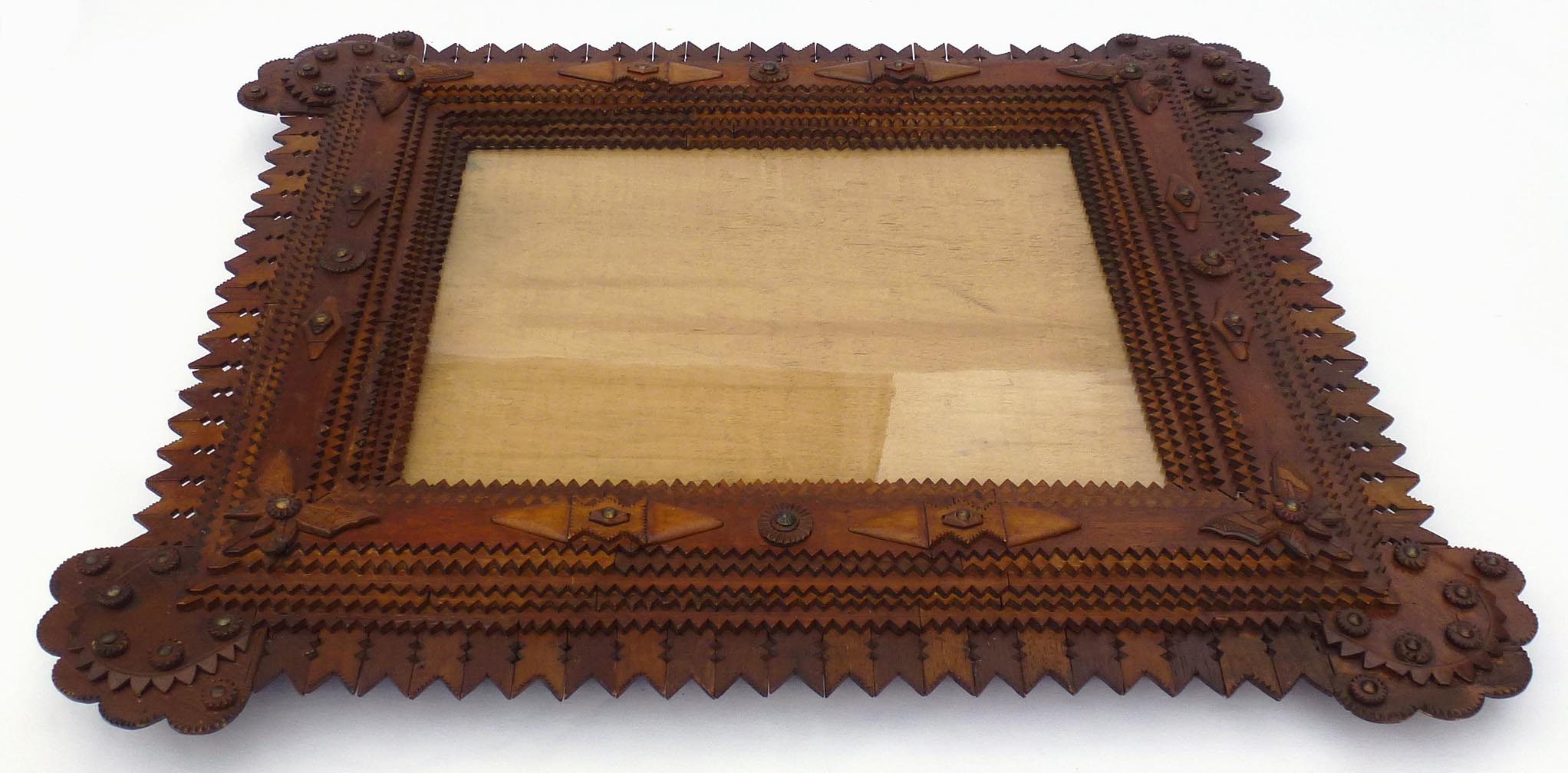 Large tramp art frame with butterflies, pieced border