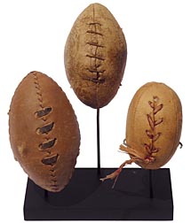 Three miniature footballs