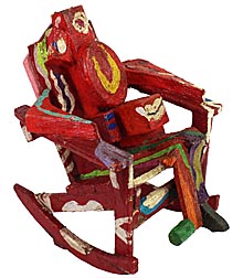 Painted figure in chair